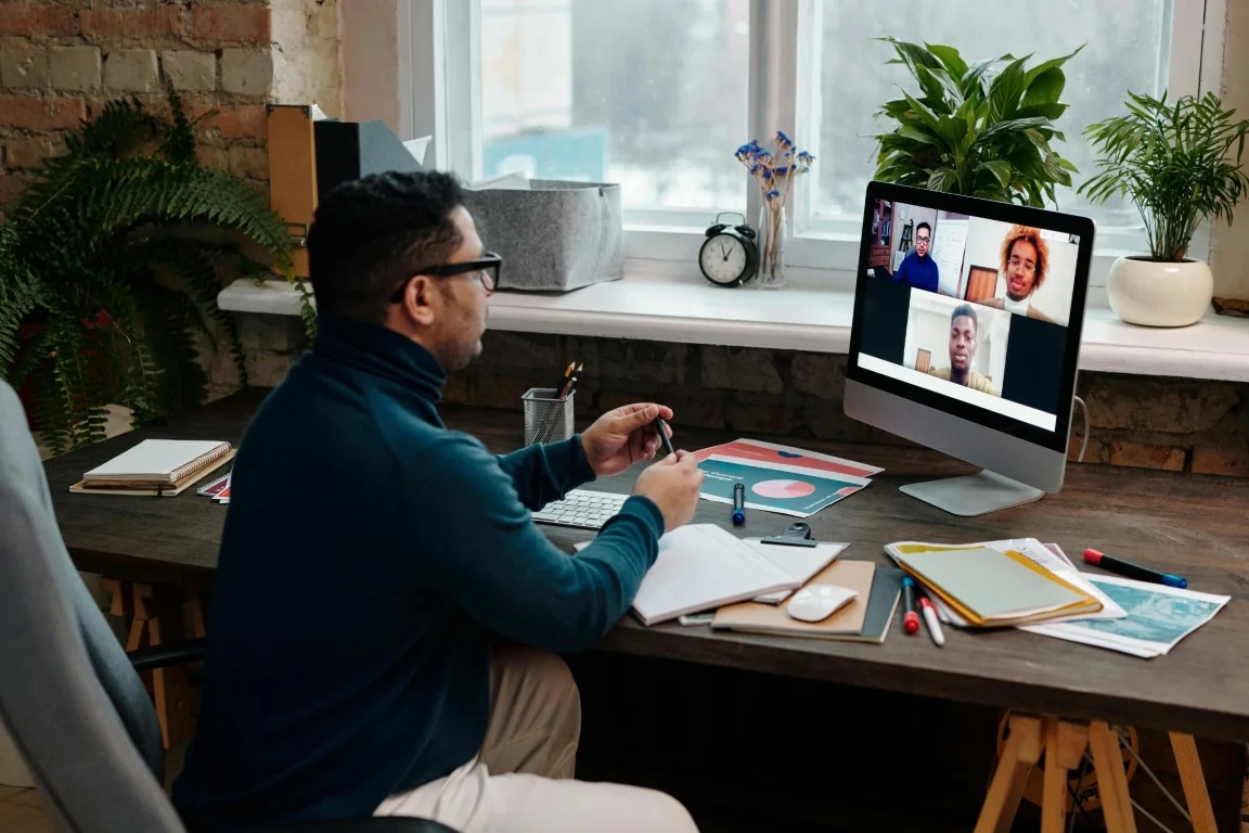 Person in a video conference at a desk